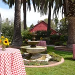 a view of the camarillo ranch barn with outdoor dining tables